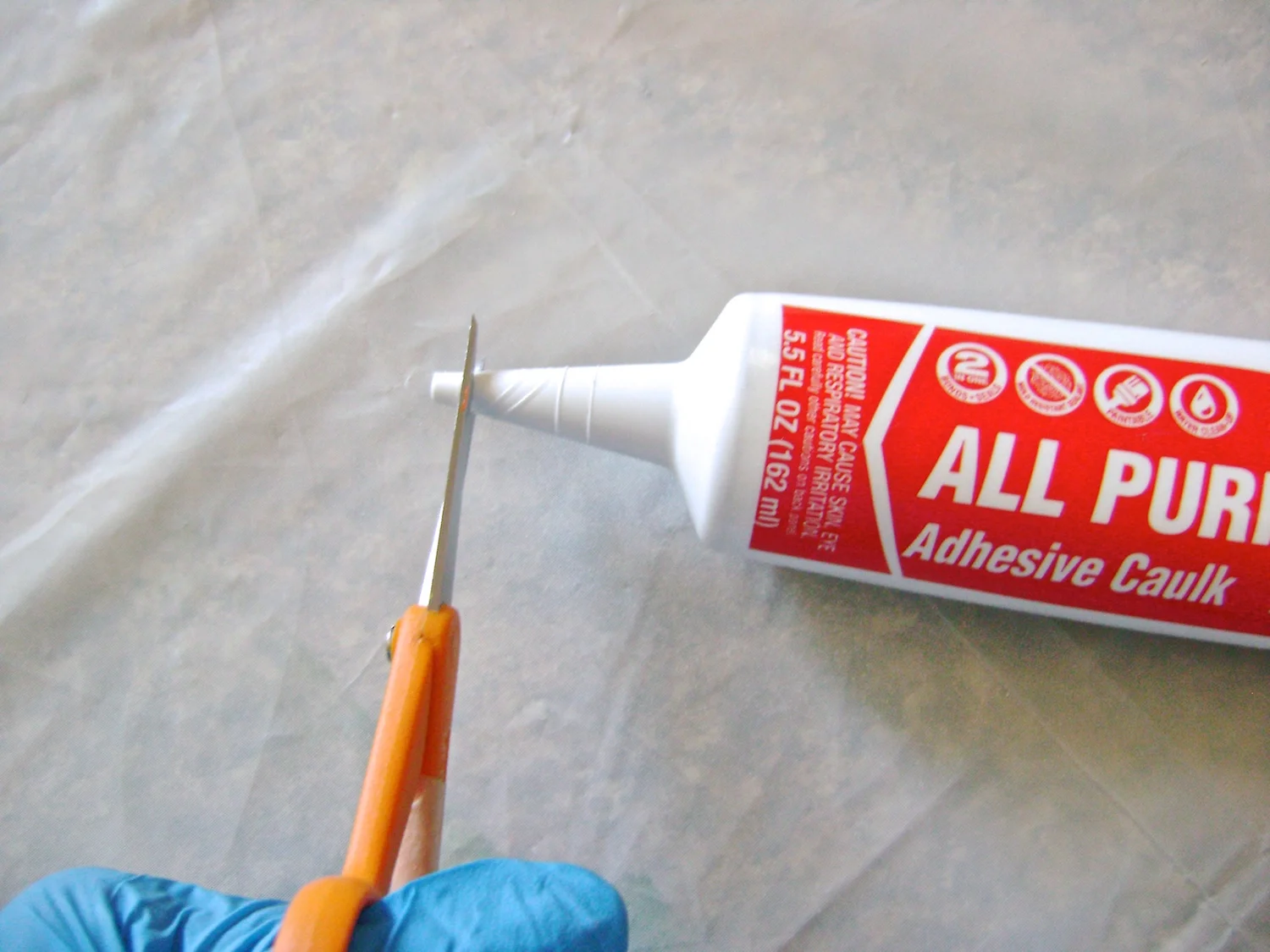 step 9 - When all the fine lines are complete, cut the caulking container at the first mark on the tip.