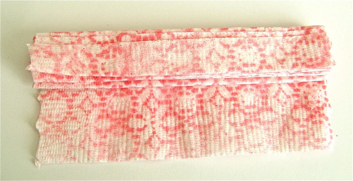 step 3 - Open the napkin to a long rectangle. Make accordion pleats along the length.