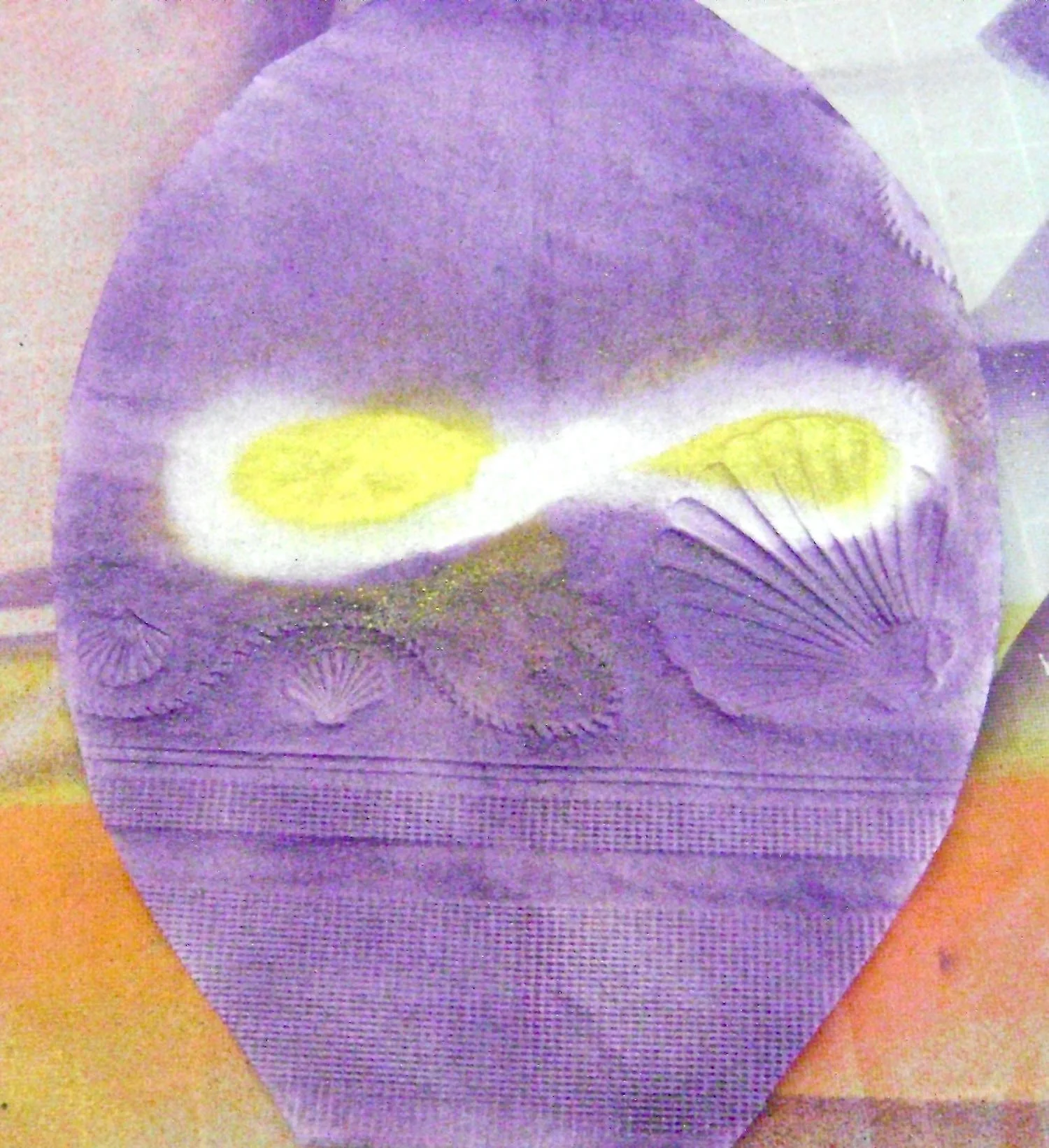step 12 - Holding the airbrush very close to the napkin, paint the inside of the loops with yellow paint. When the pipe cleaner is removed the yellow should be outlined in white.