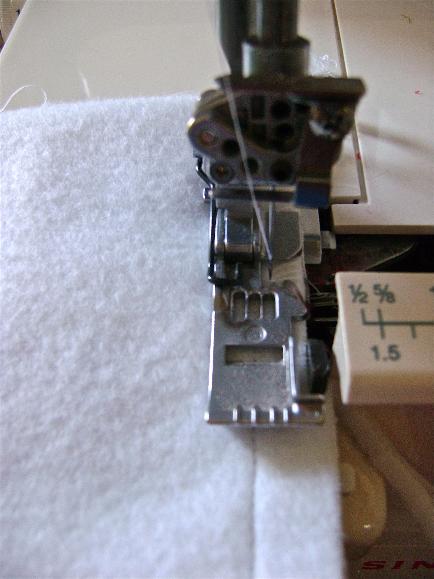 step 6 - Stitch the side seams from the top to the bottom .50” from the edges. Serge or zigzag stitch the raw edges.
