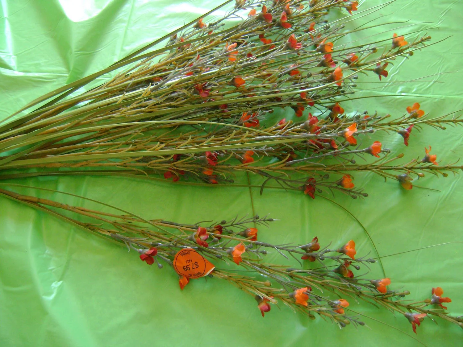 step 4 - Add the floral stems. Curve some of them slightly so they aren’t all poker straight. Glue them in place.