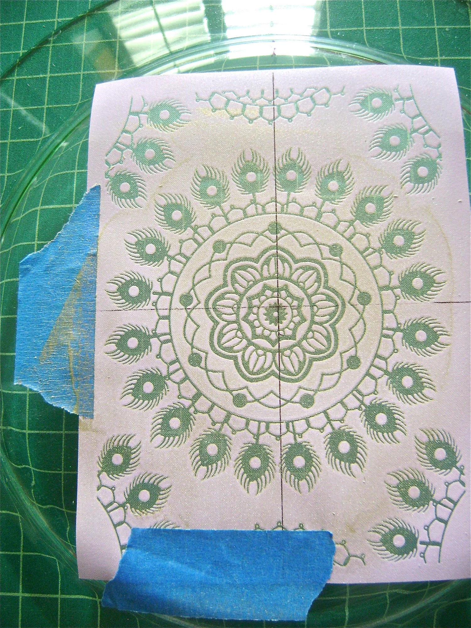 step 3 - Mark your silkscreen with the marker through the vertical and horizontal centers. Match the center of the silkscreen to the center of the plate. Tape down four sides of the silkscreen.