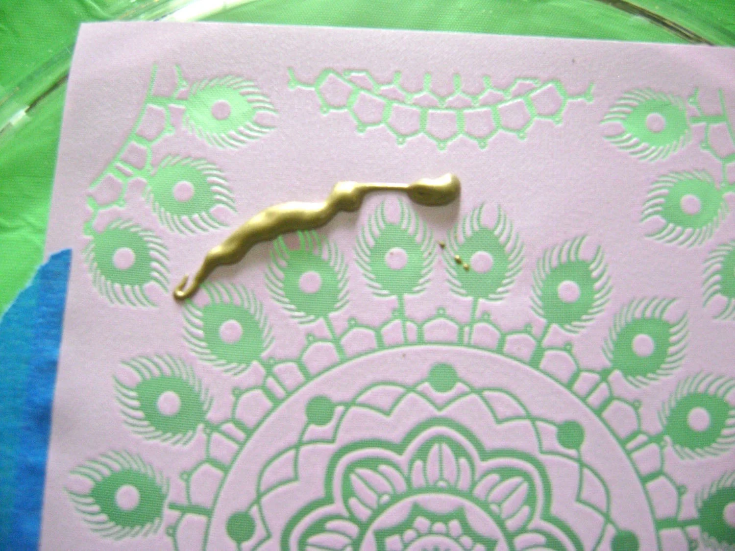 step 4 - Apply a generous line of the paint above the design to be covered.