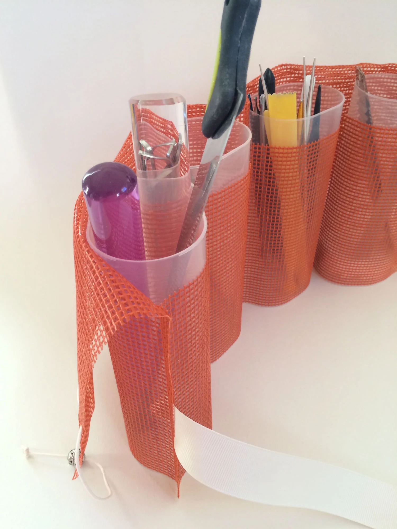 step 8 - Fold the tall fabric back down against the back side of the containers.