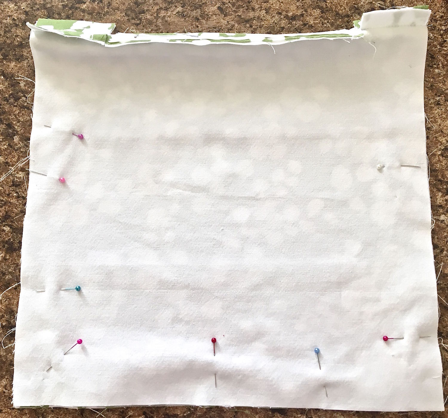 step 11 - Open the zipper. Pin the other three edges together. Sew the panels together with a 5/8” seam. 