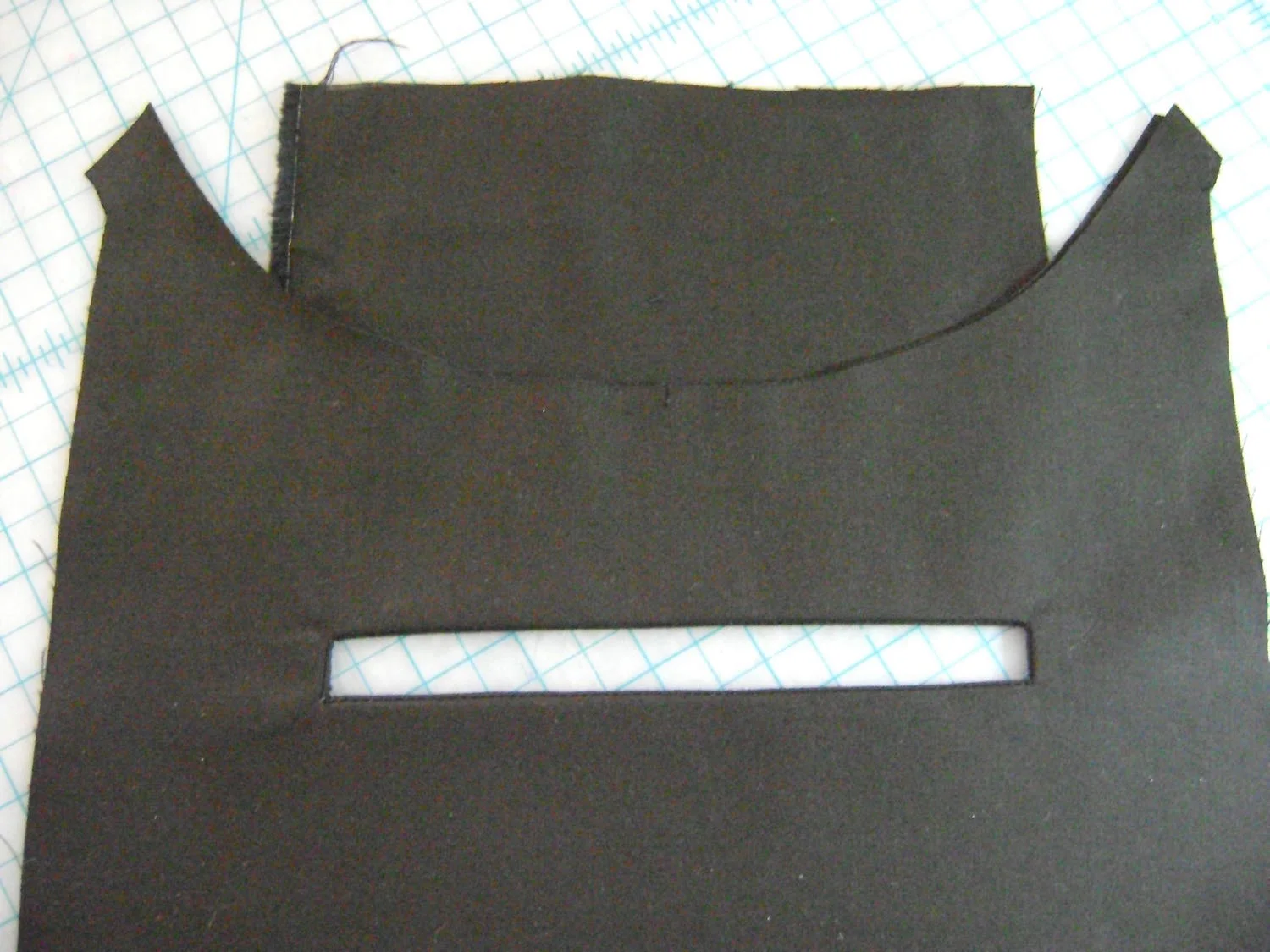 step 3 - Pull the pocket through the slit to the wrong side and smooth the opening.
