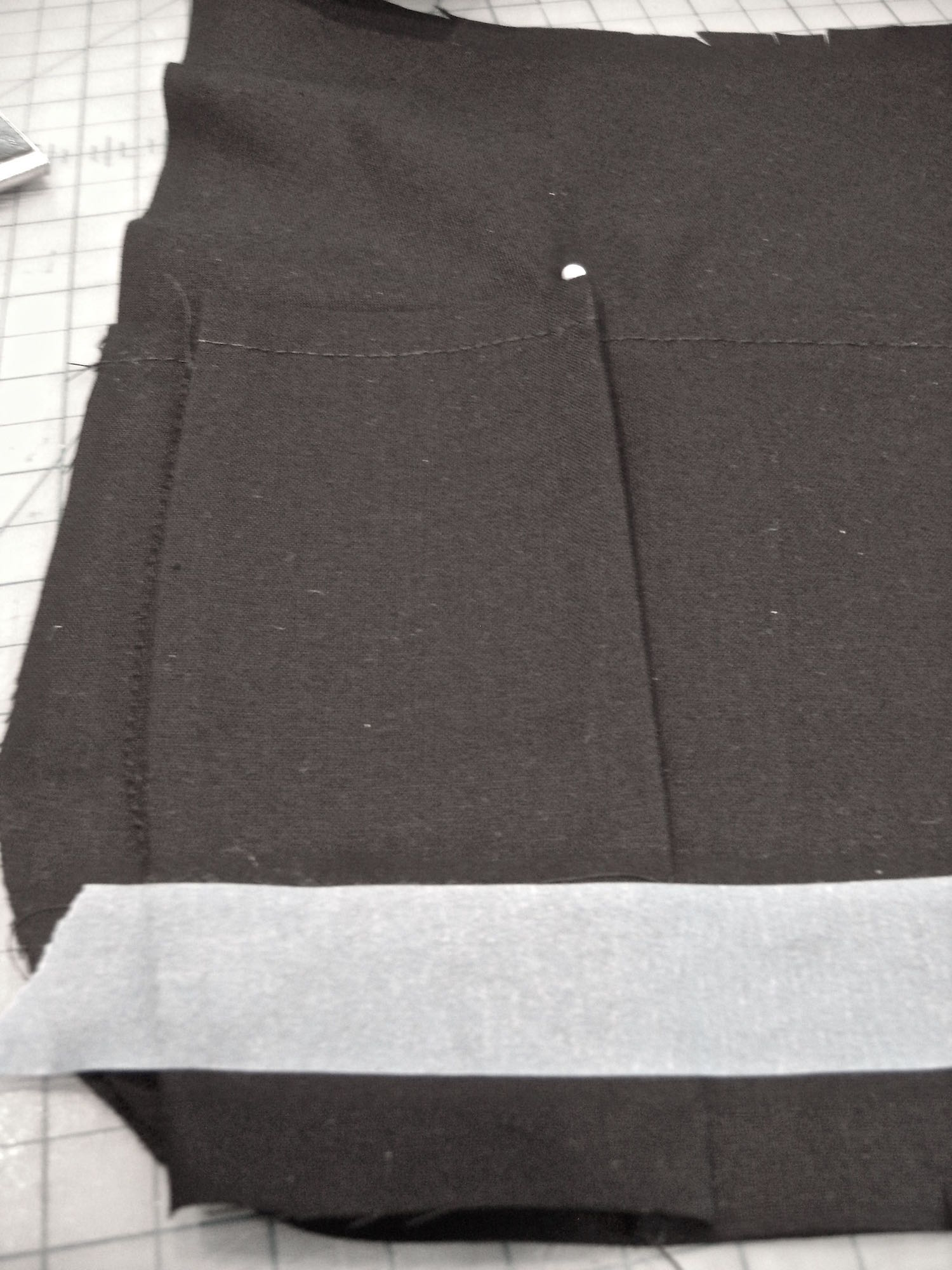 step 6 - Remove the item and lightly press, pleating the excess fabric on both pocket edges.