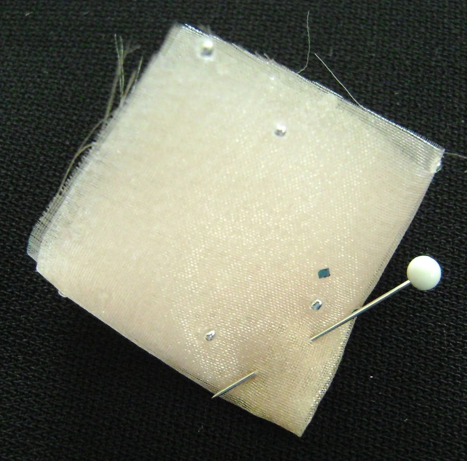step 3 - Pin together close to center or sew a stitch or two by hand at the center point.