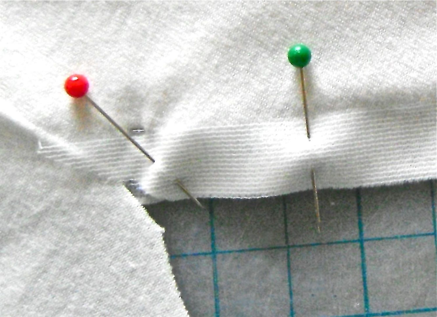 step 5 - Cut a piece of stay tape the same length as the left “V”. Pin it on the wrong side of the fabric.