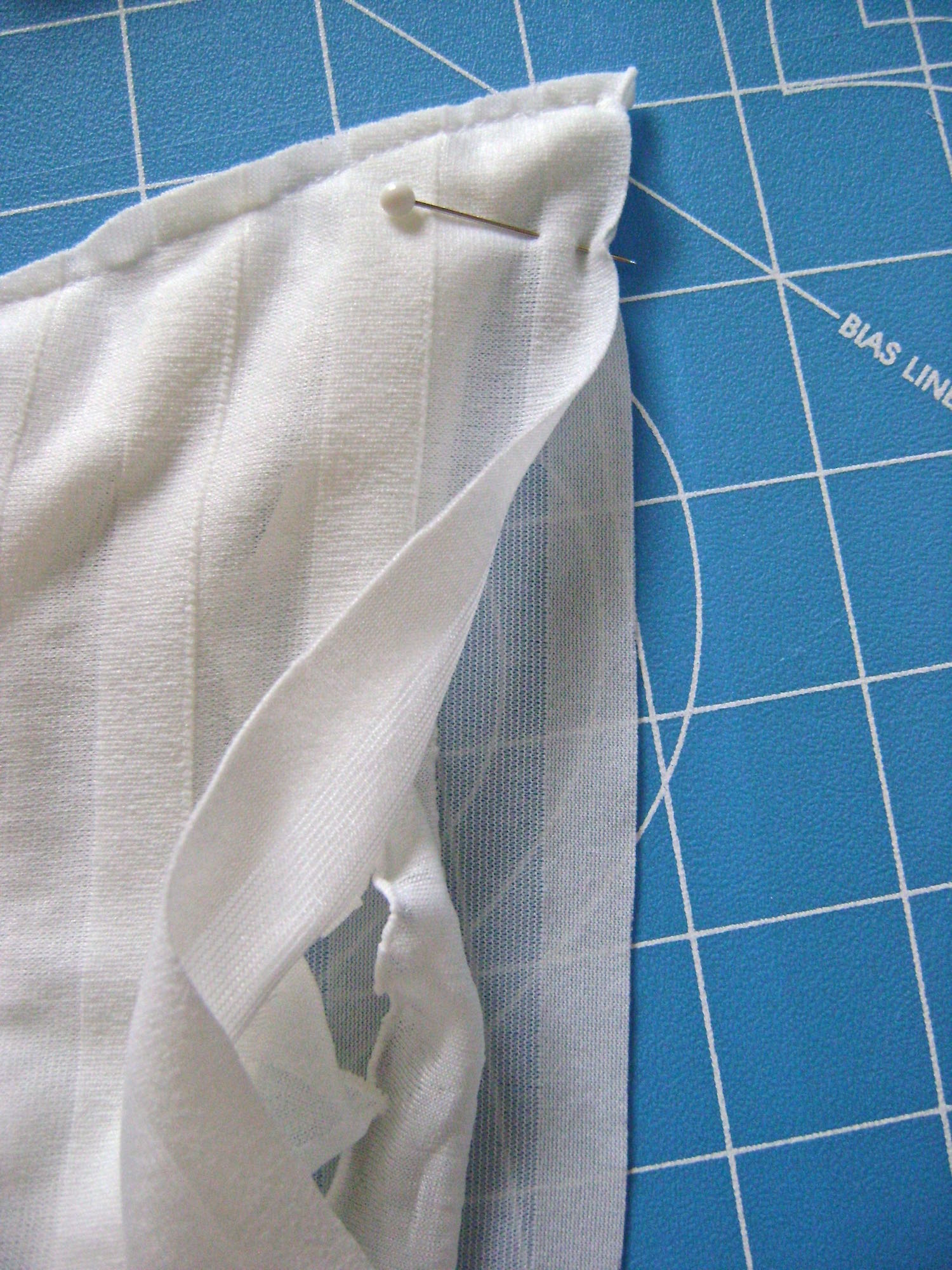 step 3 - Sew the bottom seam by moving aside the ruffles and joining the front and back with as small a seam as possible.