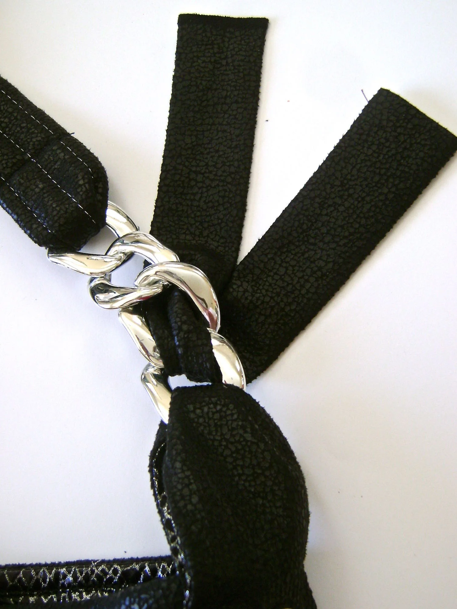 step 36 - Slip one end of the fabric piece between the purse loop and the first link. Slip the other end through the second link.