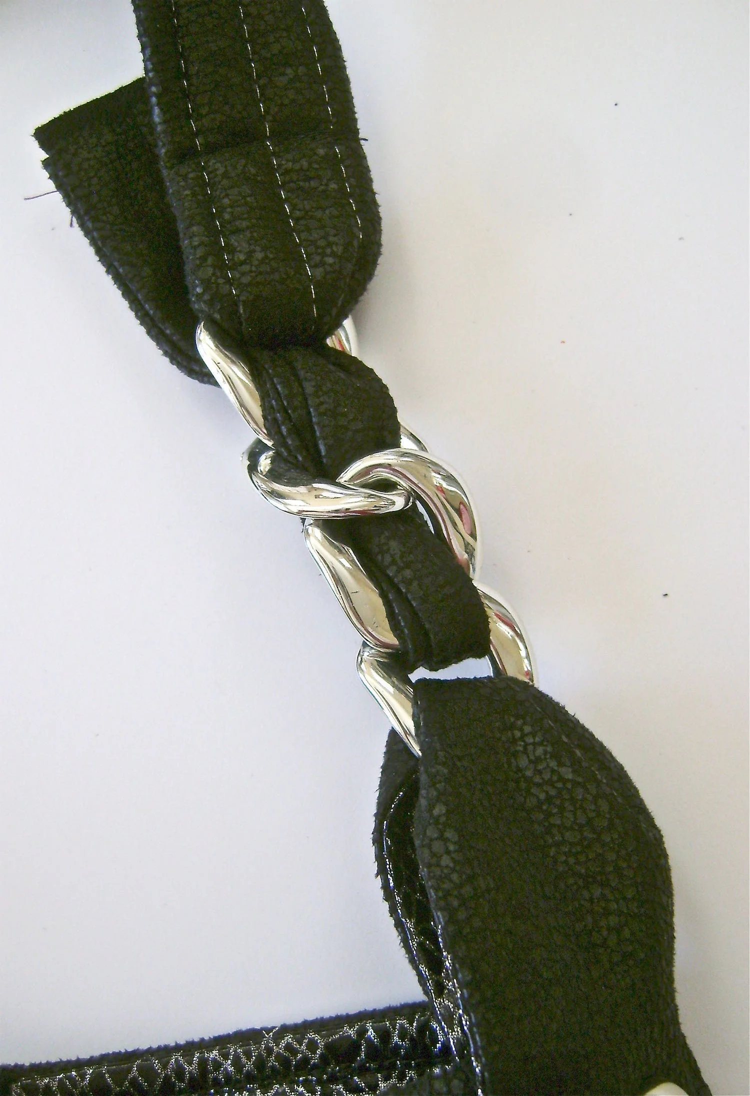 step 38 - Slip both ends through the top link and pin them behind the strap.