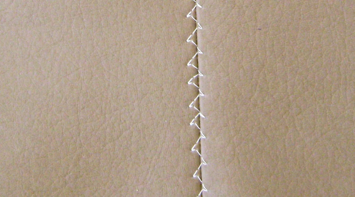 step 10 - Use a feather stitch to sew the bottom seam open.