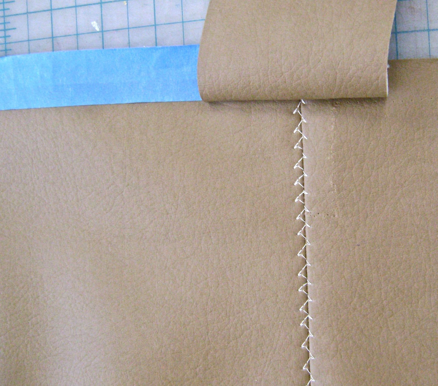 step 11 - Sew side pieces to the bottom seam with right sides together and the center of the strip aligned with the bottom seam.