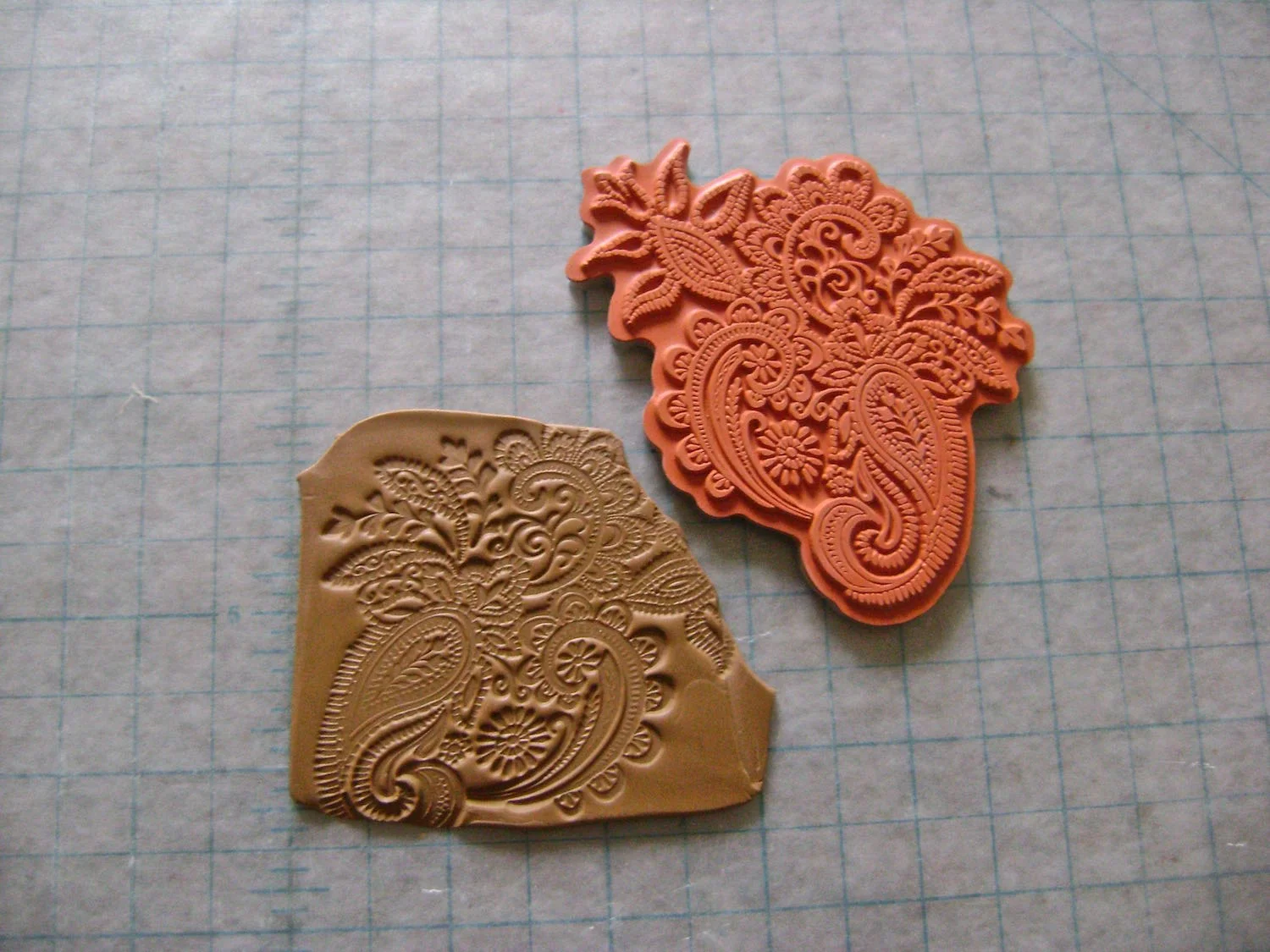 step 21 - To create two clay pieces to cover the clasps, first condition clay. Impress a floral rubber stamp onto the clay.