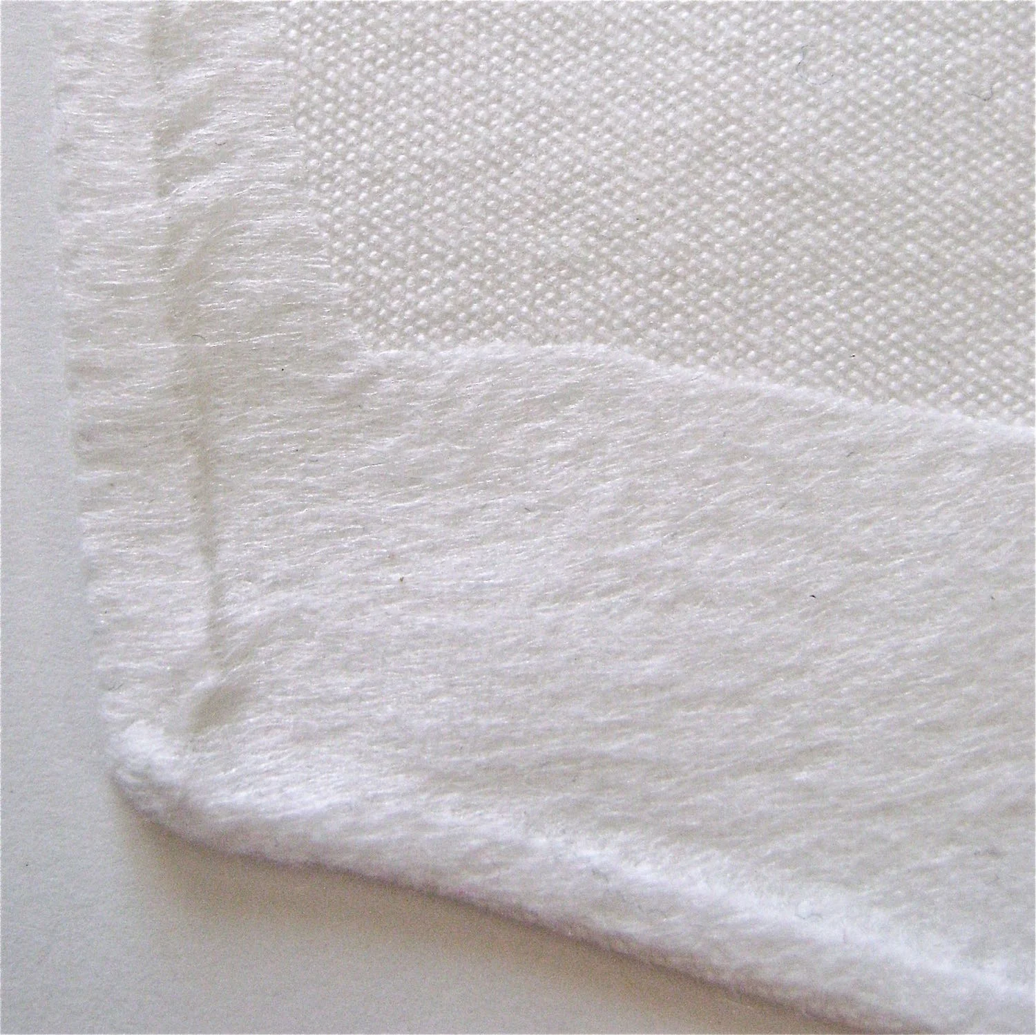 step 6 - Use scissors to cut away that excess interfacing. Press all remaining edges to fuse them.