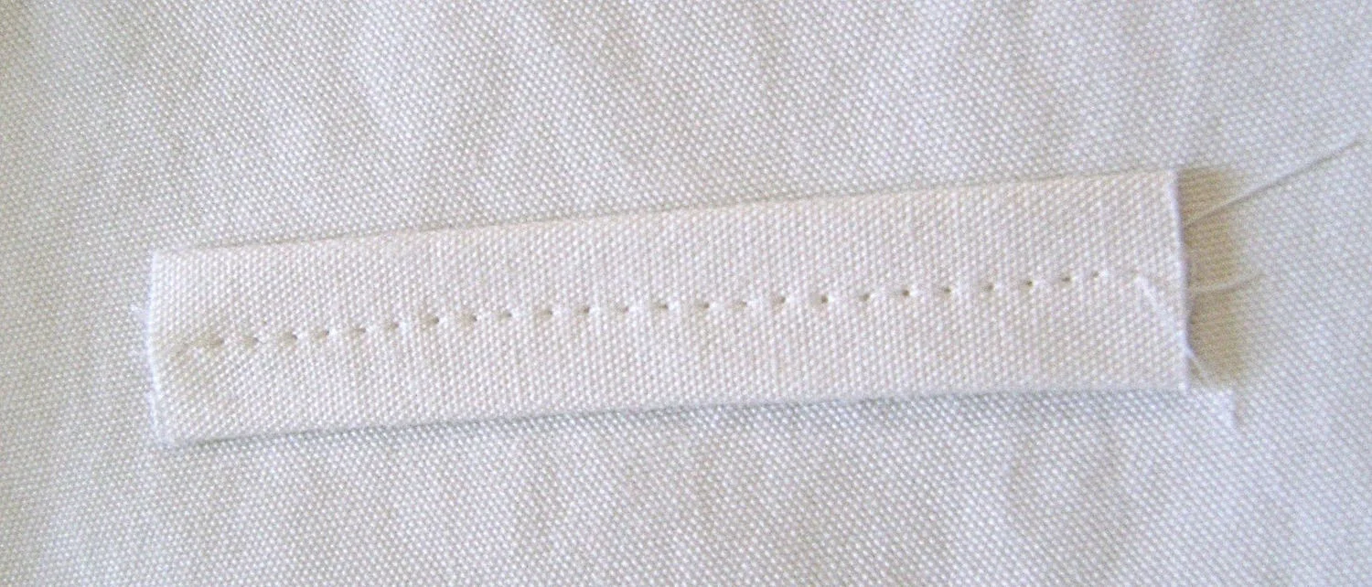 step 14 - Stitch down the middle of each belt loop then attach it to the waistband.