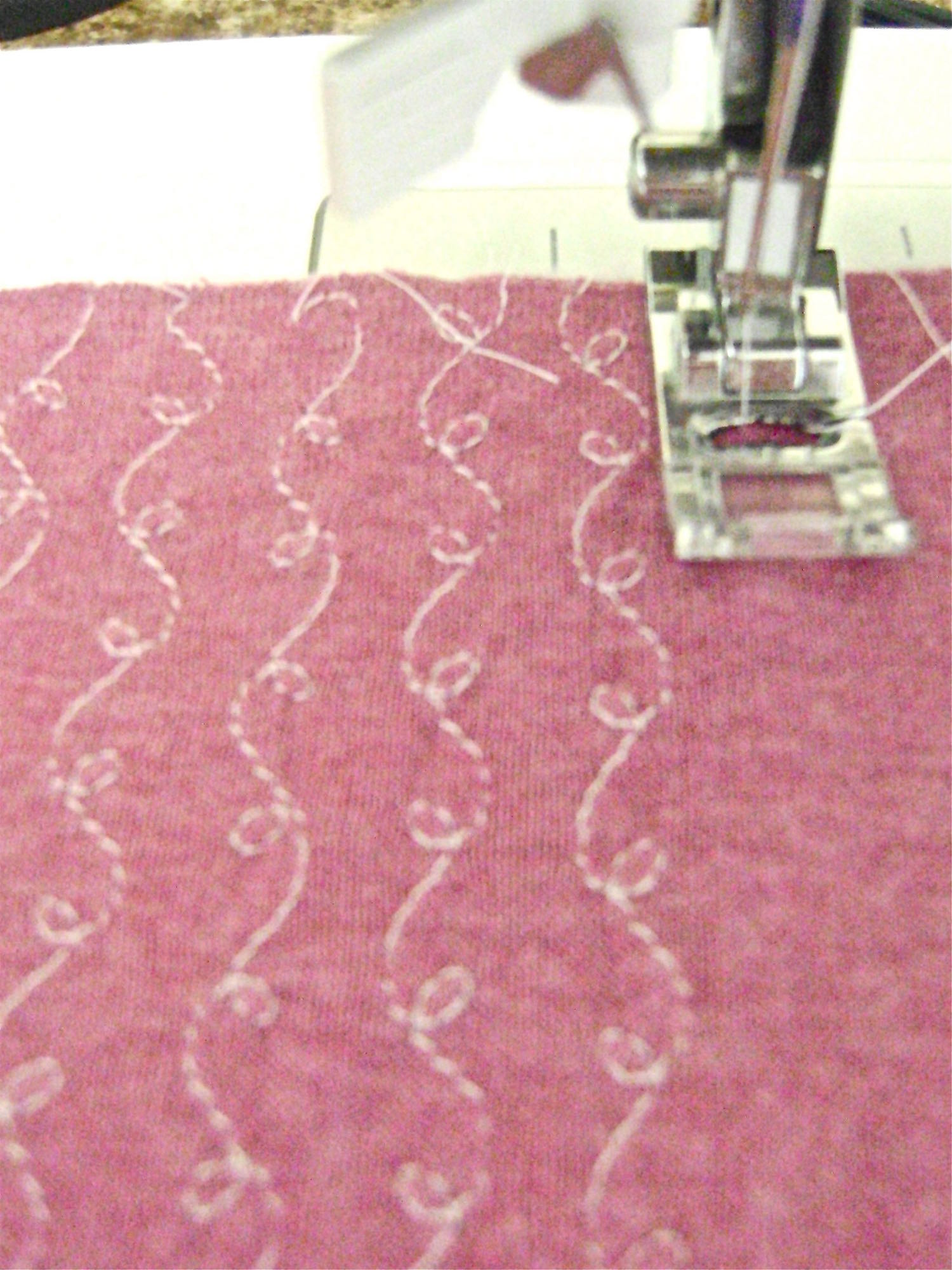 step 7 - To evenly space the rest of the stitching rows, I used the edge of my presser foot as a guide, keeping it lined up with the edge of the stitching line next to it.