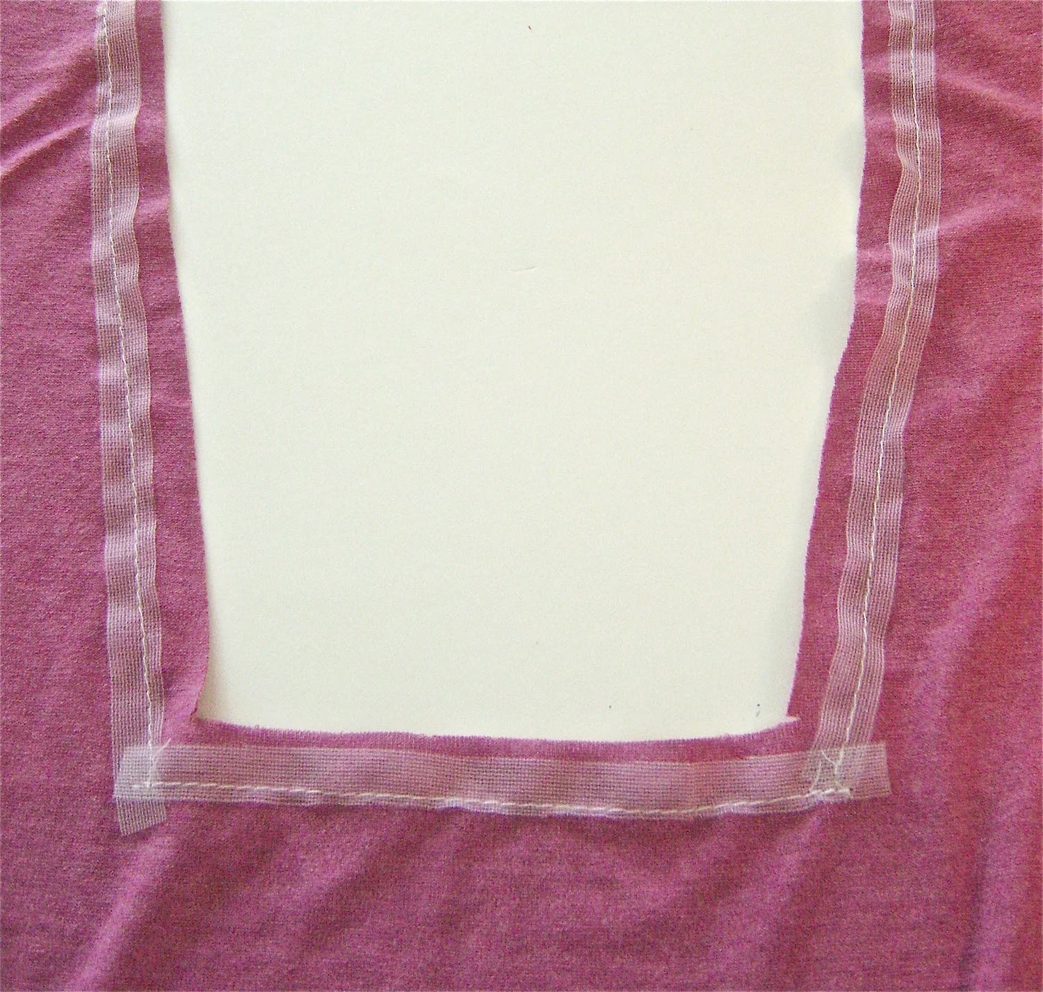 step 12 - Reinforce the opening with stay tape .50” from the edge of fabric on the wrong side. Cut into both corners but not into the stitching.