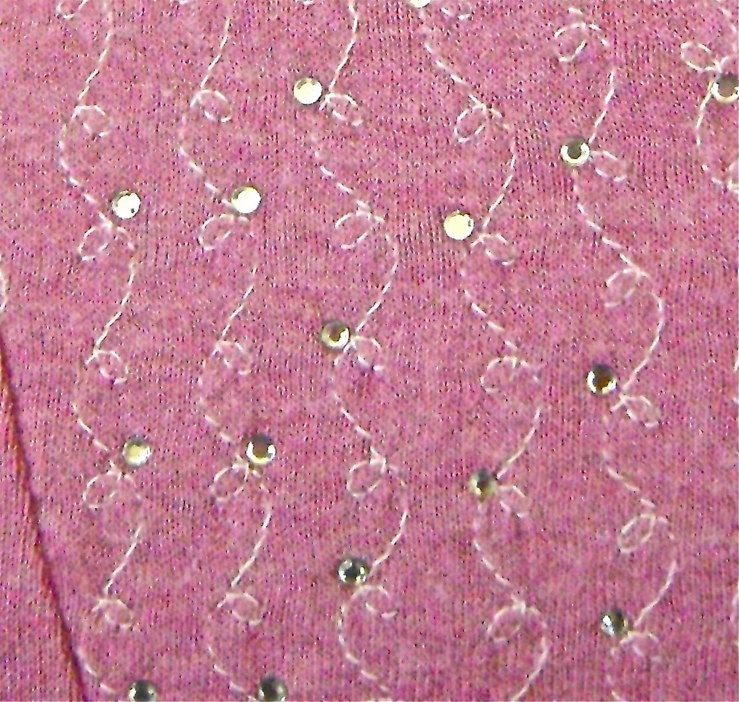 step 18 - Apply rhinestones on the stitching opposite every other loop on the vine. Attach them by pressing with an iron on a protected hard surface for 45 seconds.