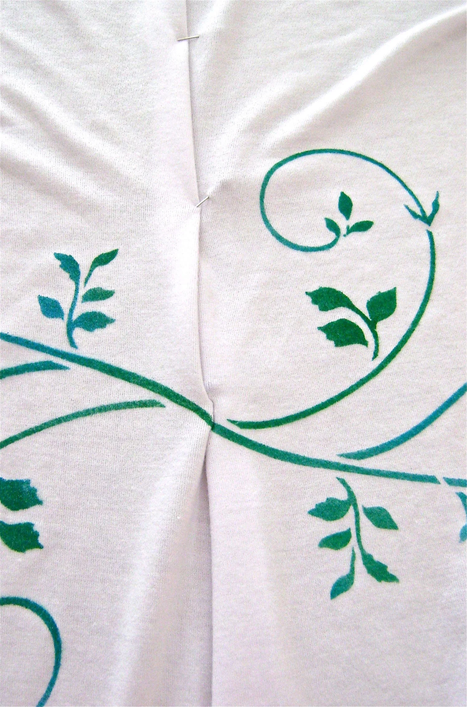 step 8 - When the paint is completely dry, pin the side seam to match up the notches and the paint design. Sew the dress side seams.