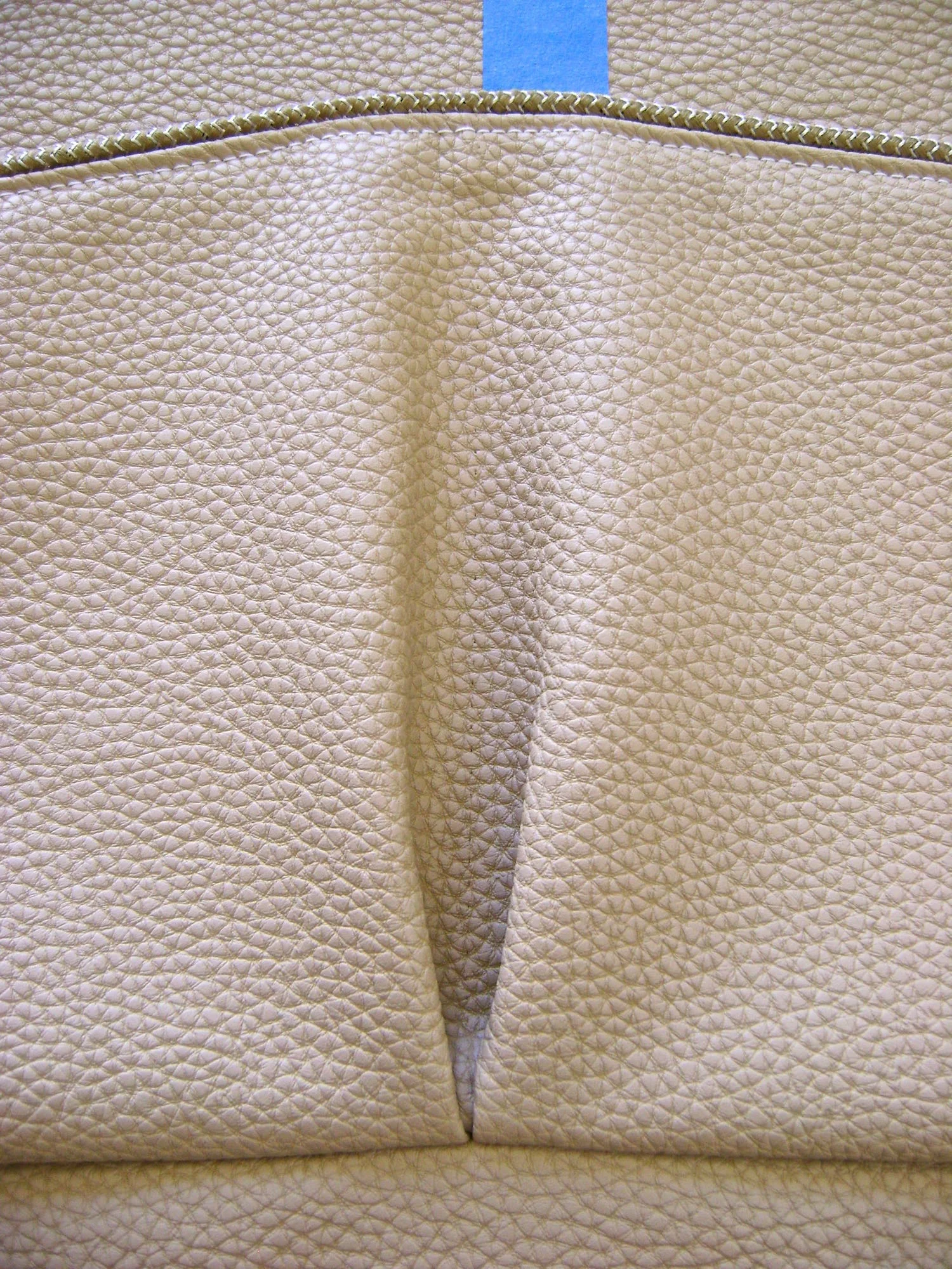 step 9 - Align the bottom pocket edge to the 1.50" line with the right sides together and sew in place. Remove the tape.