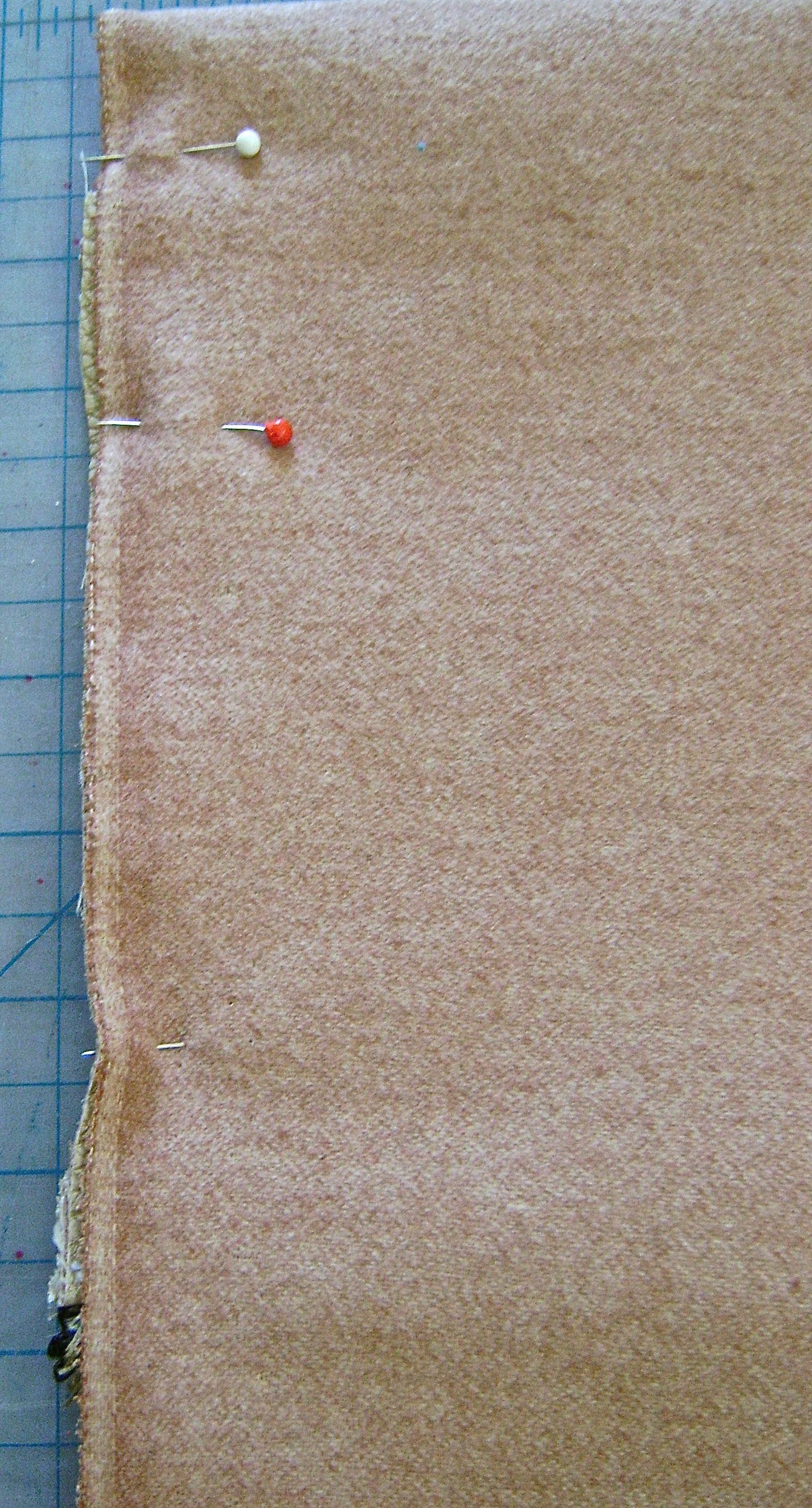 step 12 - With the right sides of the vinyl touching, pin the bag sides together.