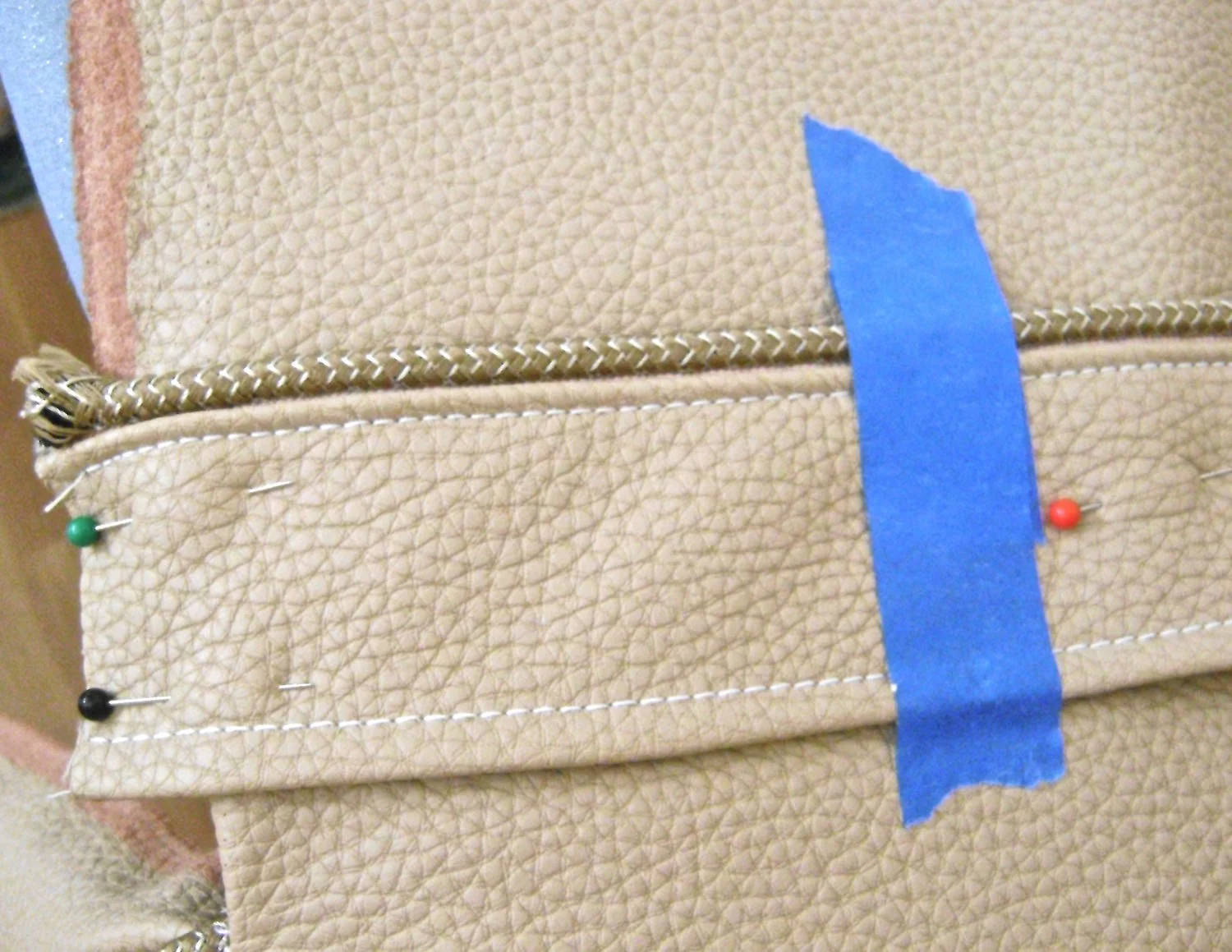 step 15 - Pin the band to the bag back 3.25 from the top edge. Place tape 4” in from the sides. Stitch the top and bottom edges of the band up to the tape on each side leaving an 8" opening in the center.
