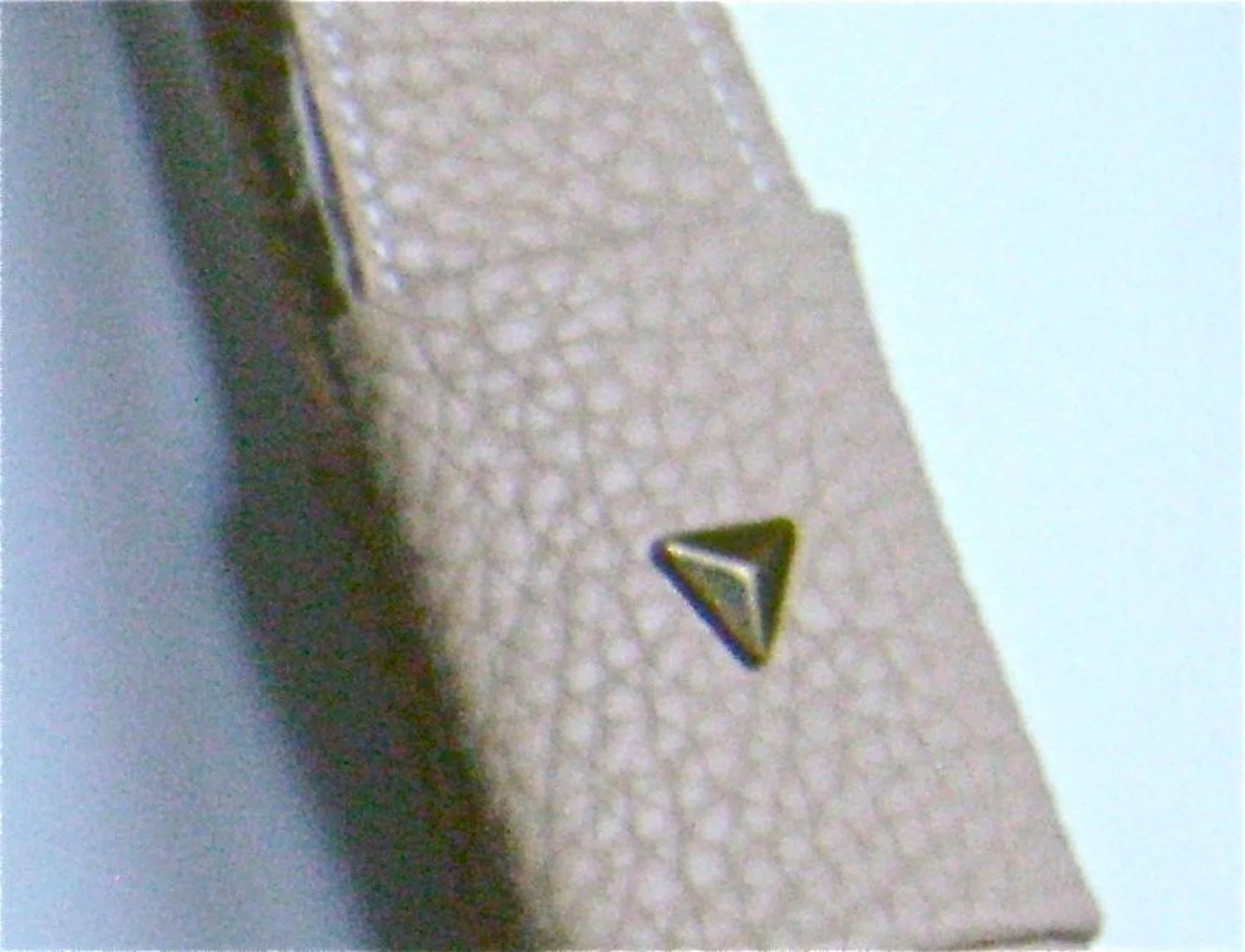 step 26 - Add metal stud triangles to the outer layer of the covers.