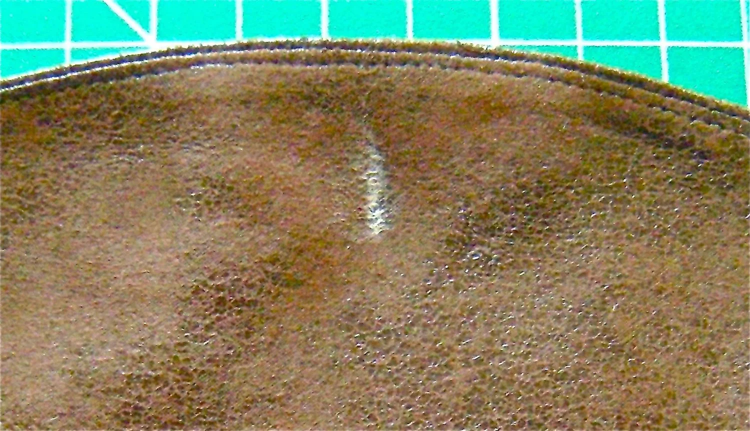 step 8 - Trim the seam allowance and topstitch it to the lining. (I used the same fabric for my lining as my outer purse.) Use a piece of chalk to mark the placement of the clasp on the flap lining.