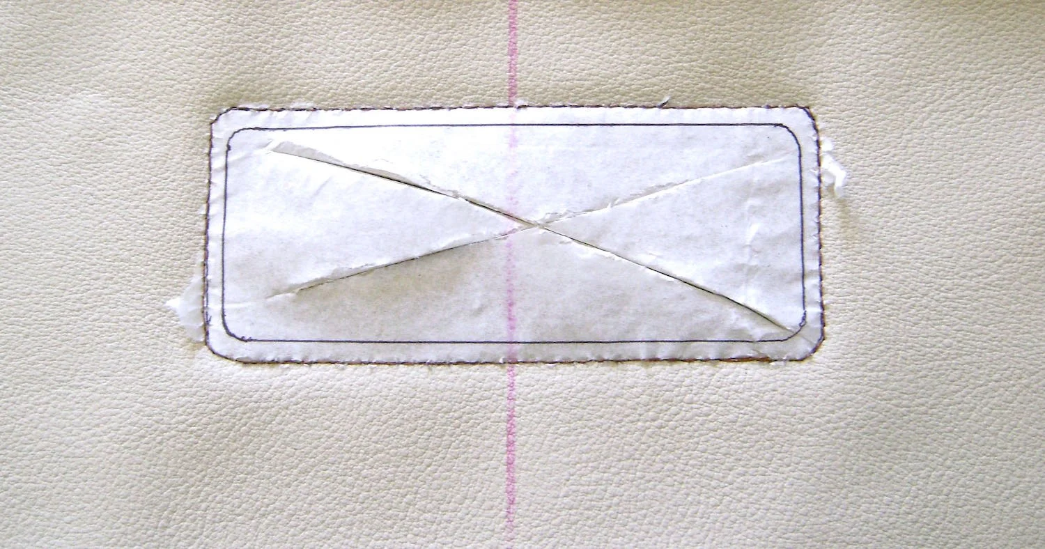 step 9 - Using copper colored thread, sew the stitching line through the tissue pattern. Slash through the center with a craft knife and cut with scissors on the cutting line. Pull away the tissue. If bits remain an old toothbrush or pressing on them with scotch tape will easily dislodge them.