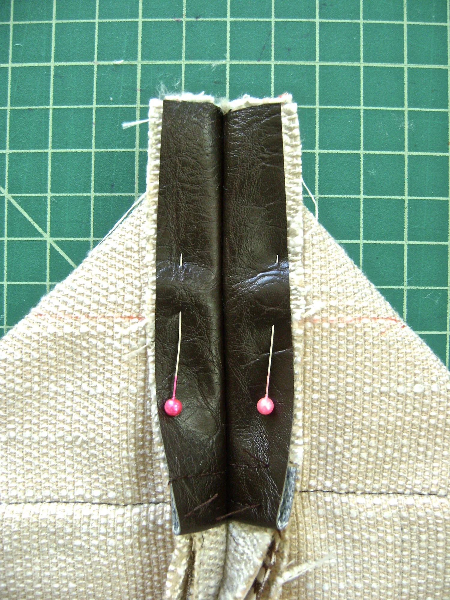 step 5 - Outer Shell Construction Outer Shell Construction Starting at the bottom, sew up the side seams with the right sides together. Reinforce the stitching across stress areas like the tops of pockets. Flatten the bottom corner of the bag and create a triangle . Draw a line across the triangle at 4" with a marker. Use a ruler to be sure the side seam is centered 2” from each edge. Sew across the line which will result in the 4” bag bottom.