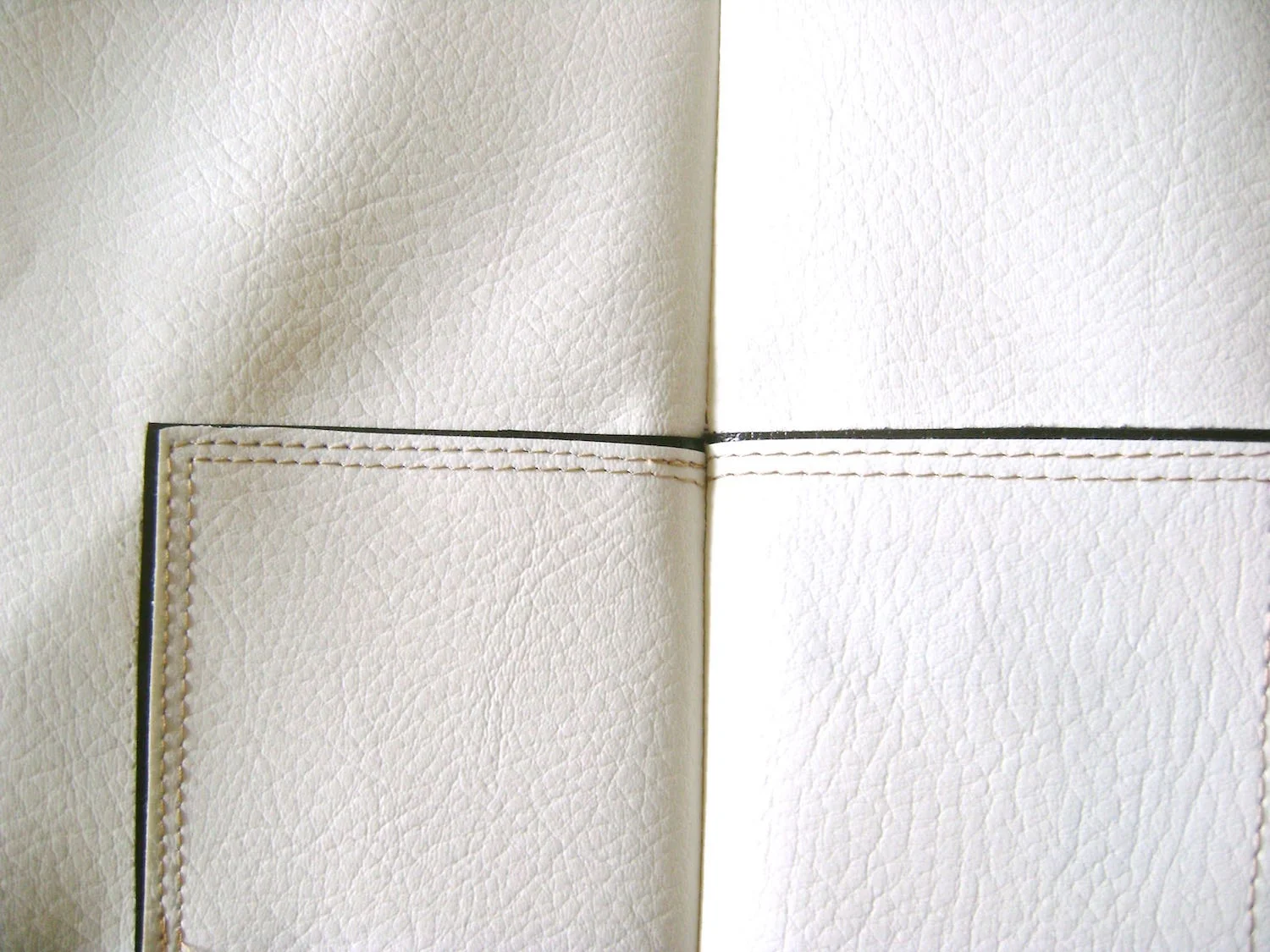 step 5 - Front and Back Align the right side of the front and back purse pieces with the black bias tape matching. Secure the pieces with Wonder Clips. They hold tight and will keep the pieces from shifting. Sew together the purse side seams. Press them open. They will not lay completely flat but pressing them open will relax the seam.