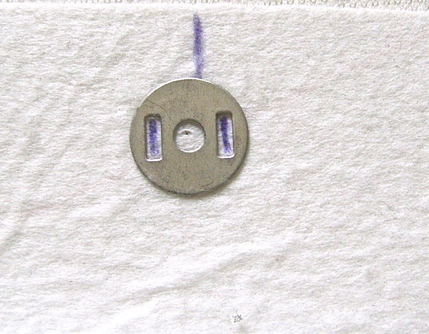 step 14 - Clasp Align the clasp hardware at the center line of each facing. Use a craft knife to cut slits for the prongs. 