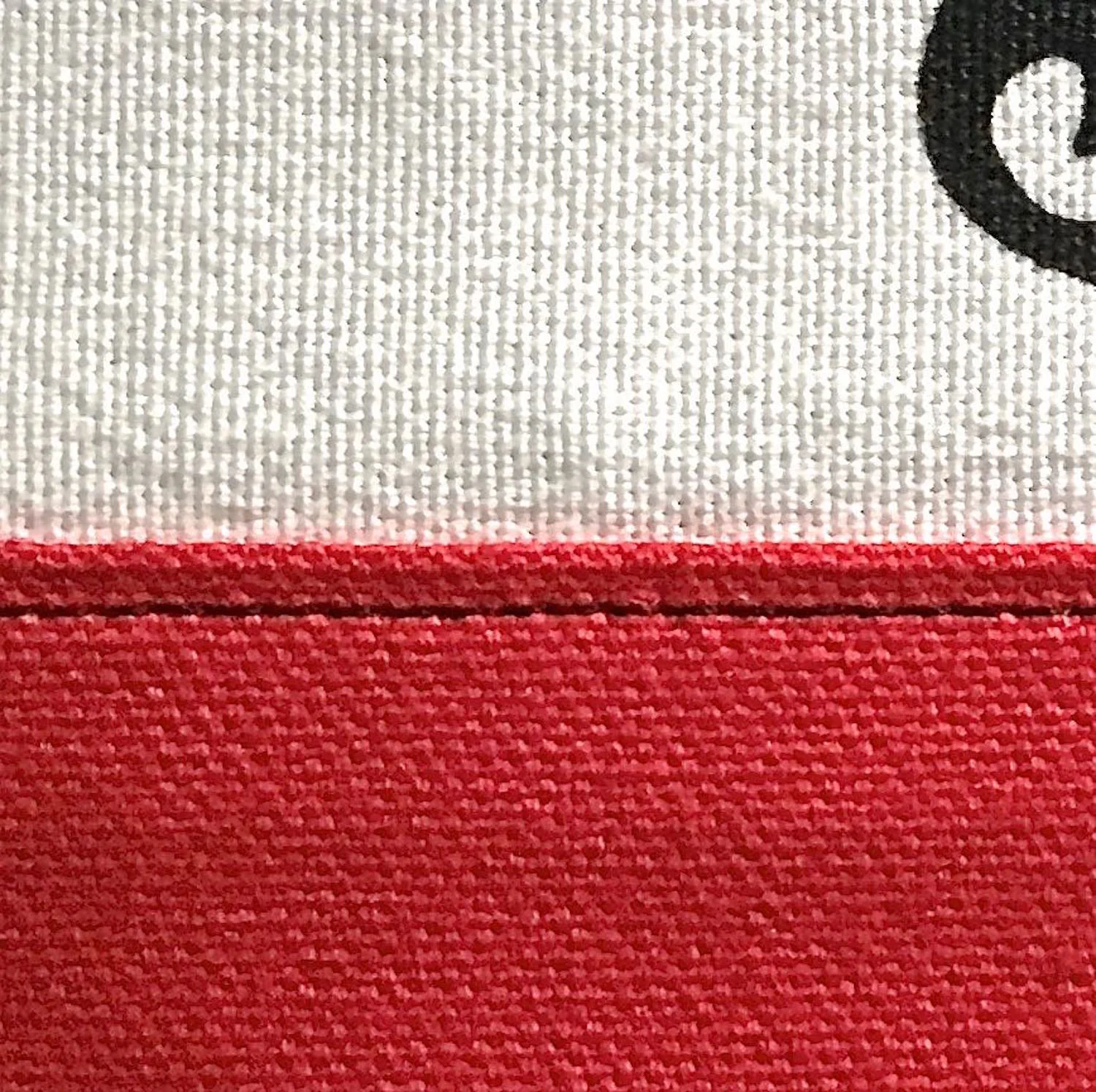 step 4 - Press the seam allowance away from the white fabric and top stitch it with black thread.