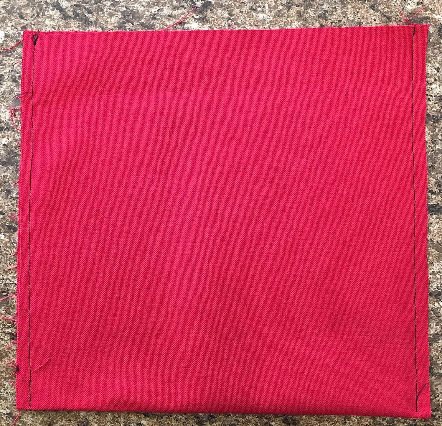 step 12 - Pocket With the fabric right sides facing each other, fold the pocket piece in half to measure 10" x 10". Stitch the sides with .25" seams. Turn the fabric right side out and press the seams. 