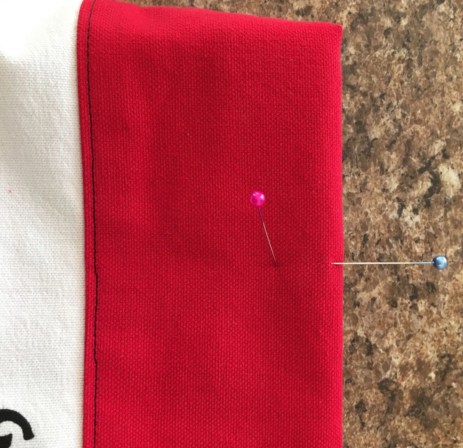 step 28 - Place pins 3.50" from the side seams and .75" from the top edge of the bag.