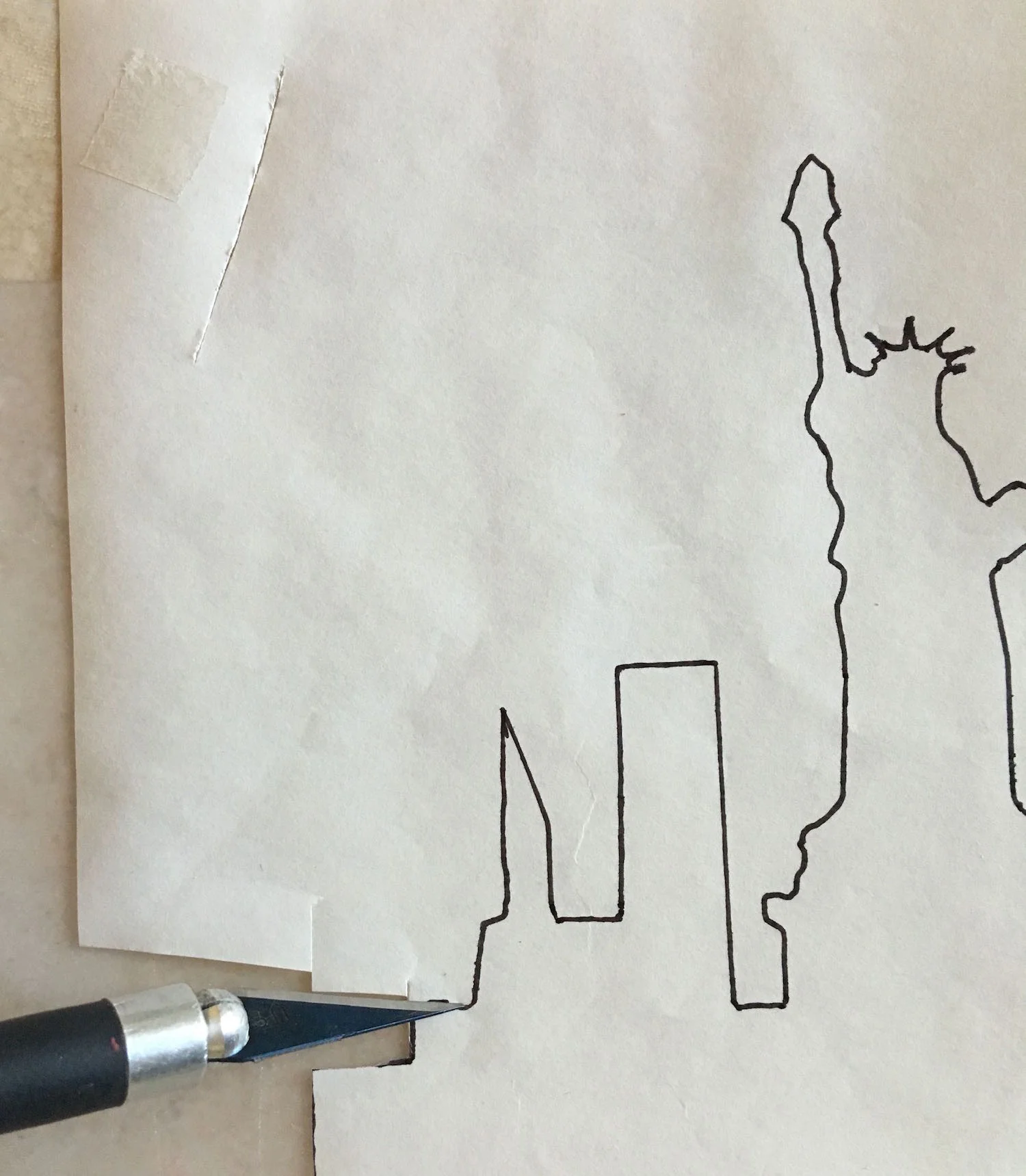 step 4 - With scissors or a craft knife, cut along the image lines. Cut inside the lines leaving no ink on the paper as ink may bond to the adhesive and become part of the finished project.