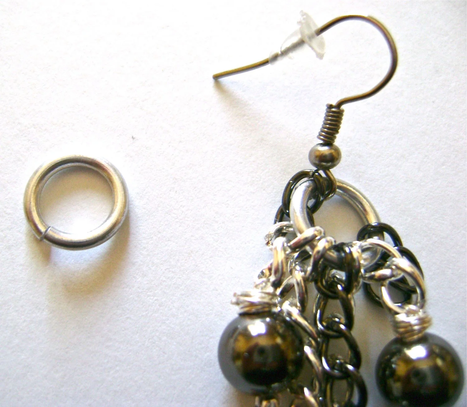 step 9 - To complete, attach the seven chain sections (see photo in step 8) in order onto a large jump ring followed by a purchased earring wire.