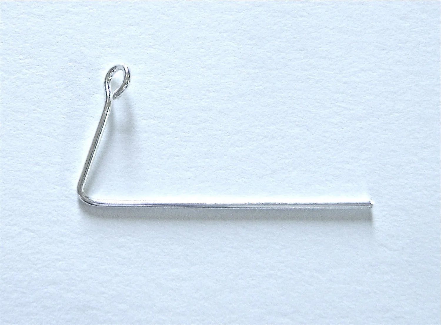 step 11 - Use flat nose pliers to make a 90 degree angle in an eye pin wire, .50” from the eye.