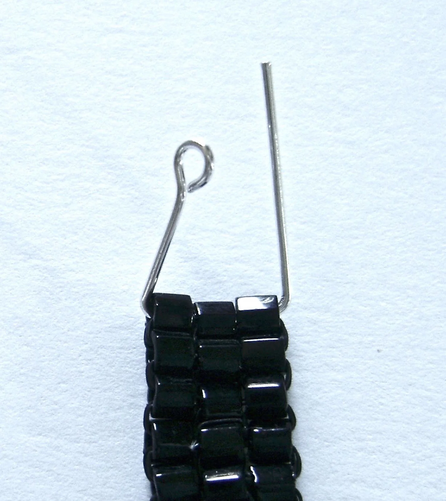 step 13 - Make a 90 degree angle in the straight end of wire.