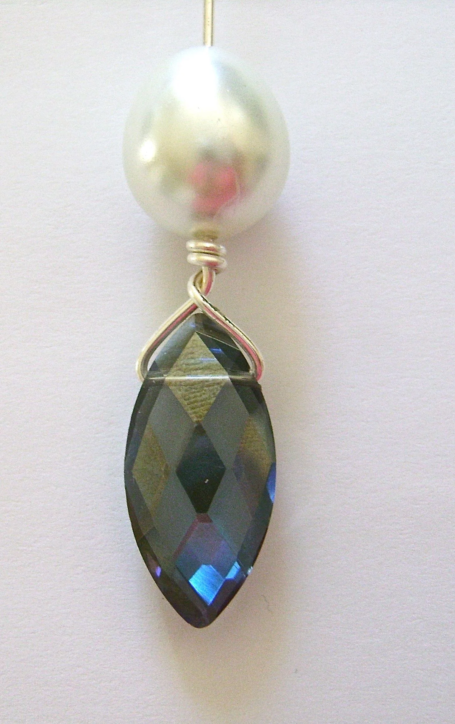 step 3 - Insert the long wire into the pearl sliding it all the way to meet the wrap.