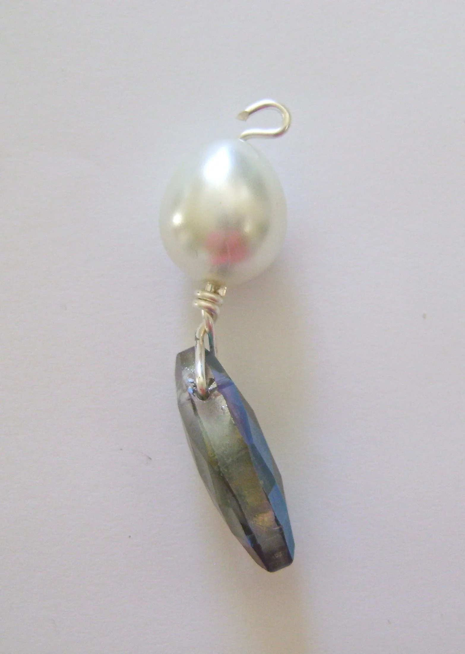 step 4 - Create a loop in the wire above the pearl. If you’re unsure of how to do this see the steps in Jewelry Making Tools and Techniques.