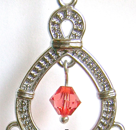 step 6 - Open the loop in the 6mm rose bead and attach it to the top inside center of the teardrop.