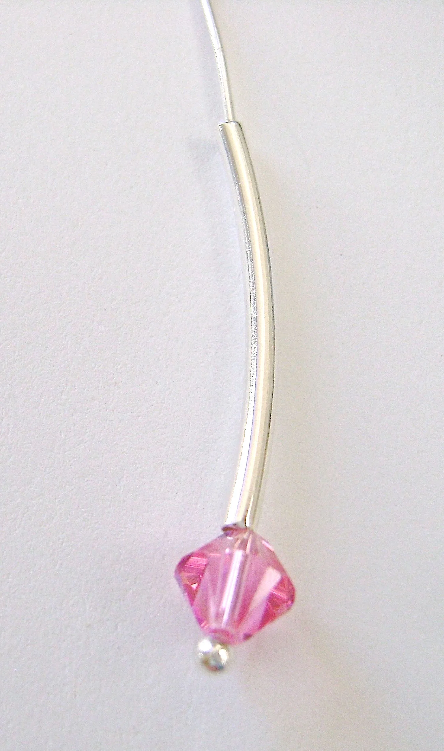 step 2 - Feed a ball pin wire though a bicone bead and a long silver tube.