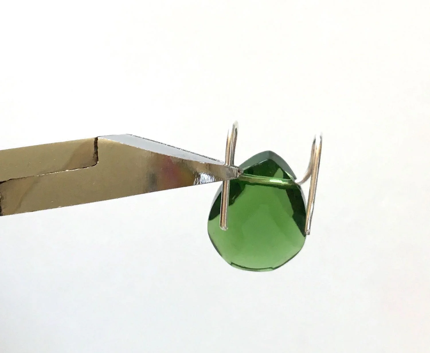 step 5 - Position wire cutters aligned with the bead hole and snip off the excess on both wires.