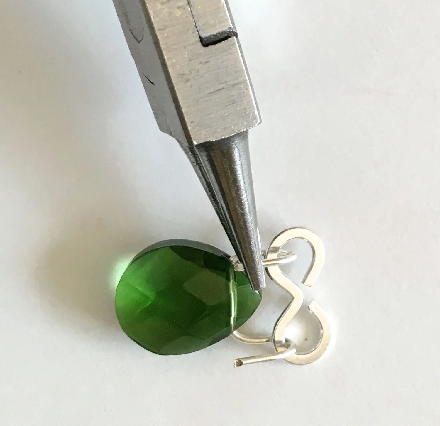 step 7 - With the very tip of the pliers, turn the end of both wires to close them.
