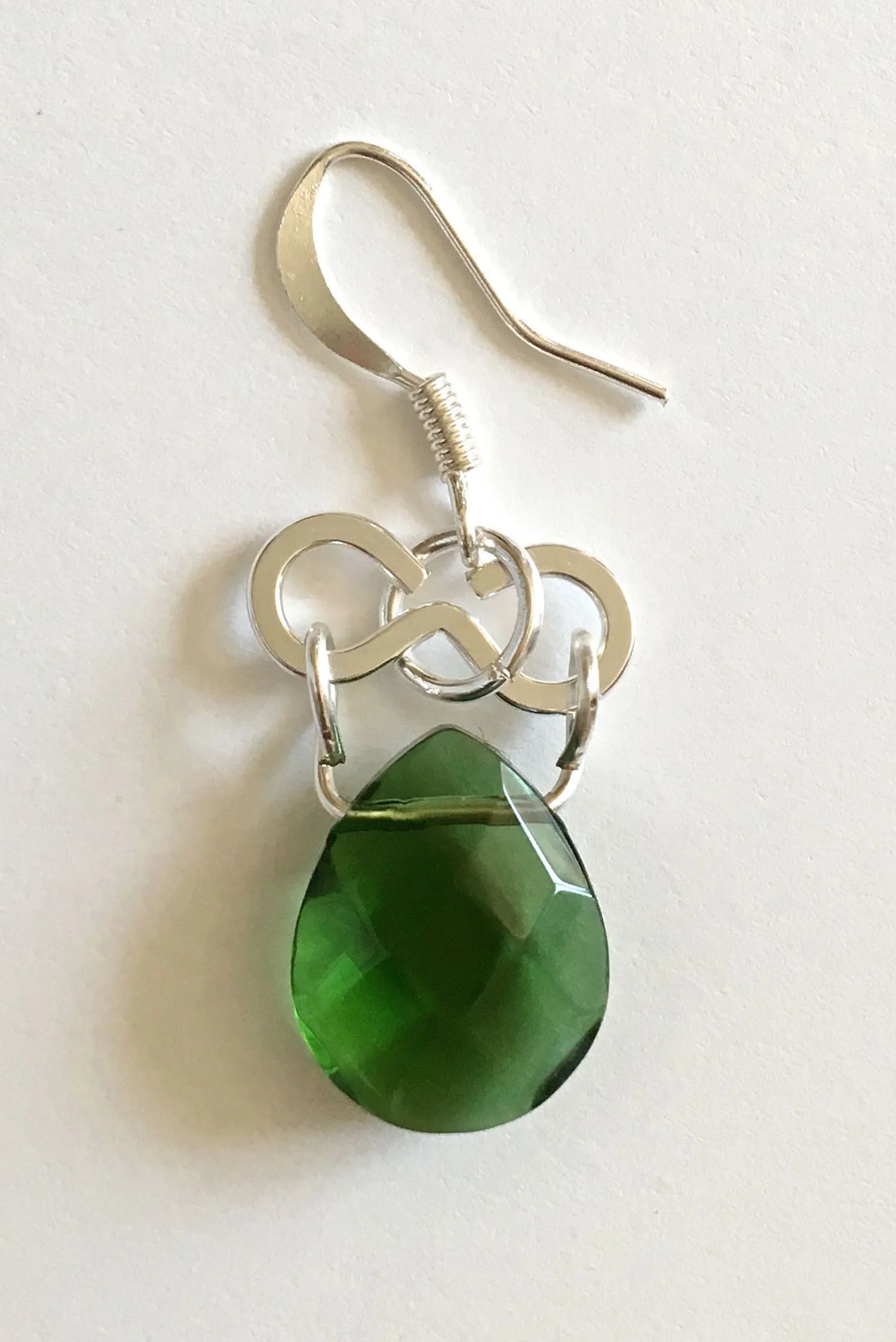 step 8 - Attach an earring wire to a jump ring. Connect the jump ring to the center of the metal figure eight.