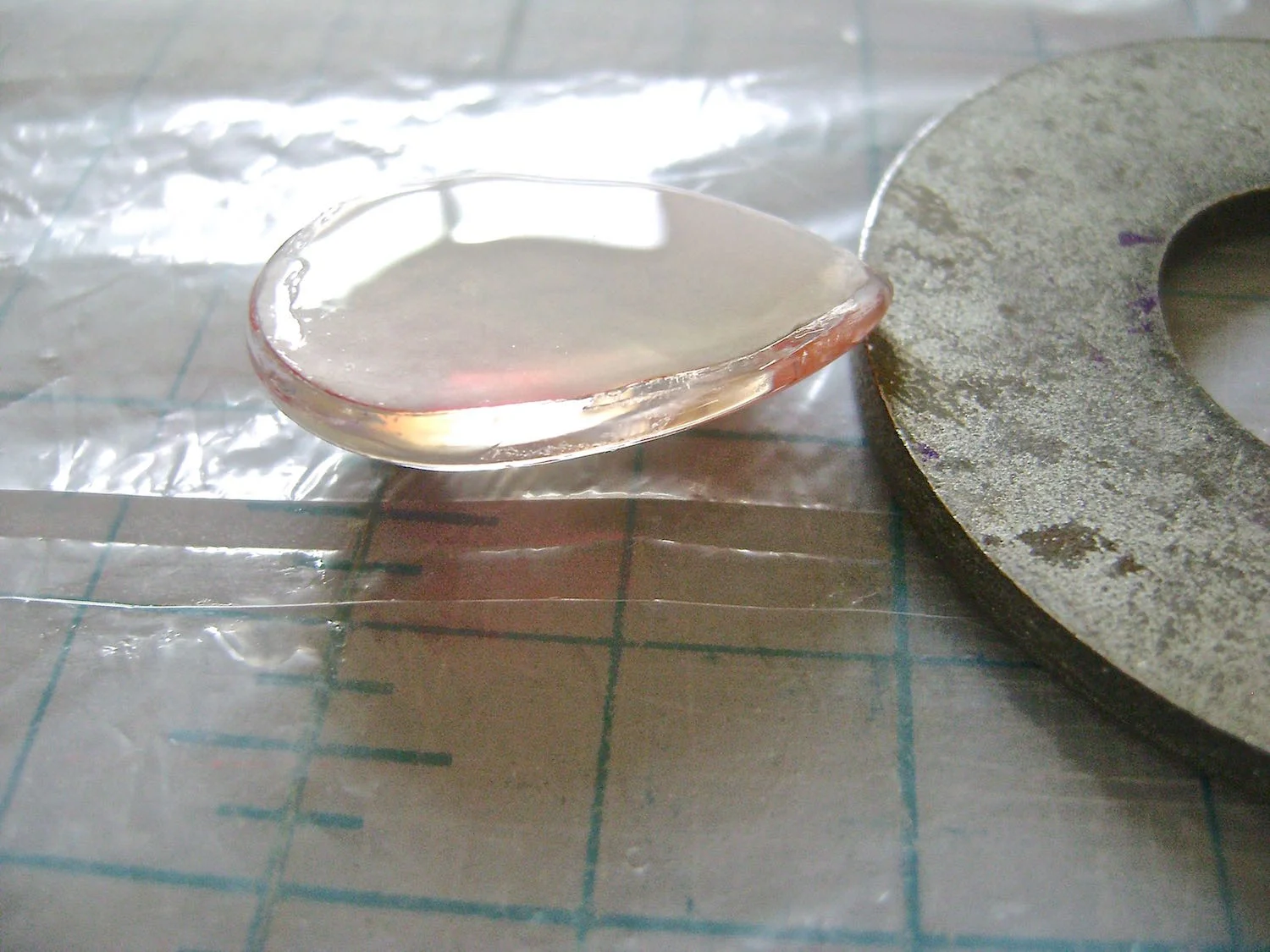 step 12 - When you place the teardrop glass on a surface it does not sit perfectly level and the glaze will pool at one end. Prevent this by propping the point of the teardrop up to make it level. Drying time for the glaze will depend on how thick it has been applied. It’s a good idea to let it set overnight.