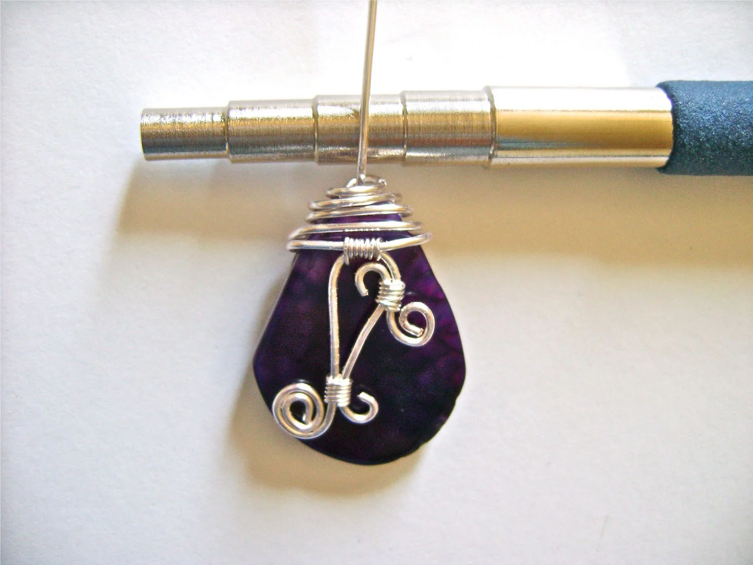 step 14 - Smooth the straight wire and wrap it around a round object until you have used up the wire. Slip it off the object and trim off extra.